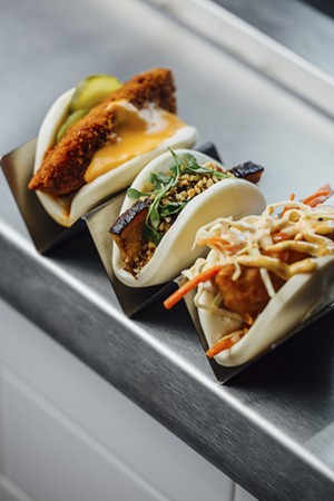 From left: crispy fish bao (fried cod, cole slaw, tartar sauce and spicy mayo), pork belly bao (braised pork belly, kewpie mayo, peanuts, scallion oil) and Angry Bird bao (spicy battered chicken with cheese and pickles) - KATHY TRAN