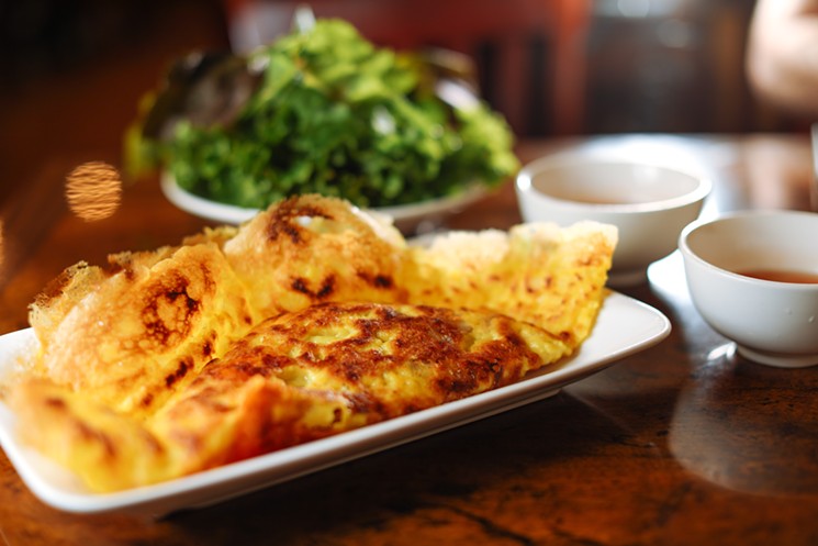 This savory crepe is filled with Vietnamese staples like pork, brisket and green onion. - KATHY TRAN