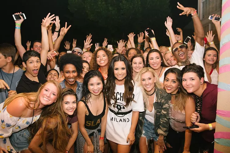 Demi Lovato poses with fans, including the winner of the contest, Lexi Weekly (front left). - NICK SMALL