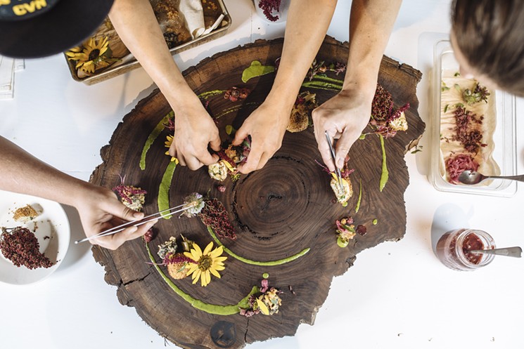 The chefs create a spread of dishes using foraged ingredients. - KATHY TRAN / WOOD BOARD COURTESY WRIGHT EDGE