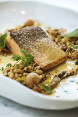 Salmon at Mirador is currently served with fried fennel, field peas and fresh herbs. - KATHY TRAN