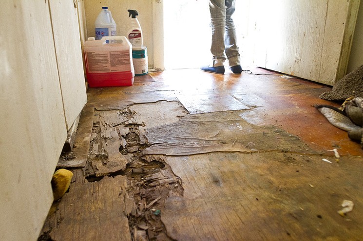 The floor in Brown's kitchen needs repairing. - MARK GRAHAM