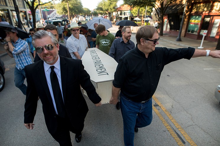 A New Orleans-style jazz funeral procession paraded through Bishop Arts on Aug. 15 to celebrate the death of controversial Trinity toll road. - BRIAN MASCHINO