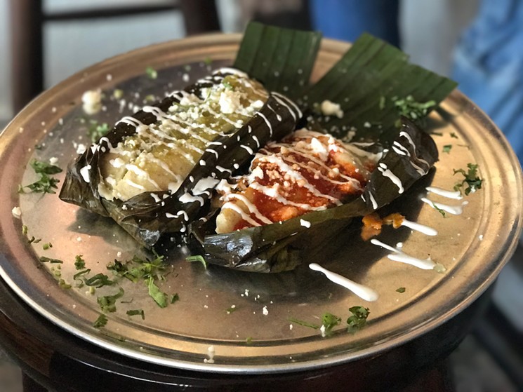 Las Almas Rotas' most popular new dish: these gorgeous tamales steamed in banana leaves with housemade masa and the meat of your choosing and topped with crema. - BETH RANKIN