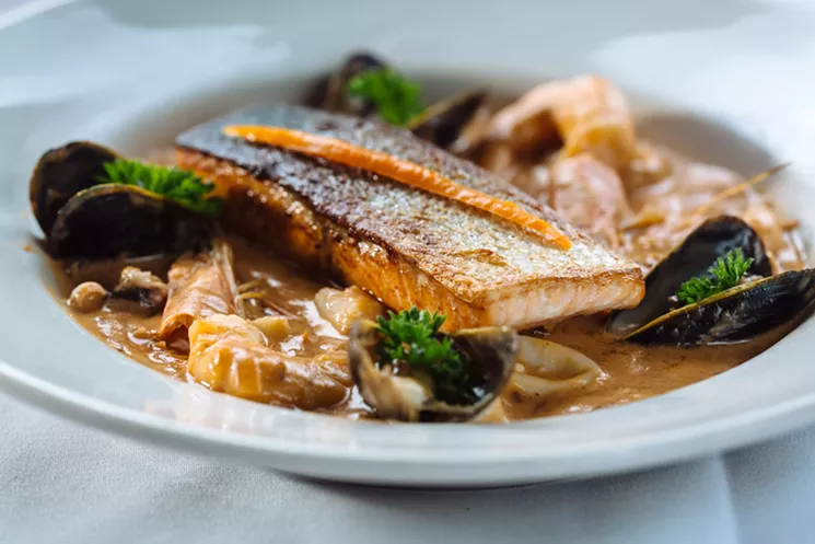 Lima Taverna's pescado a lo macho is a big, boisterous parade of seafood, almost all of it perfectly cooked. - KATHY TRAN