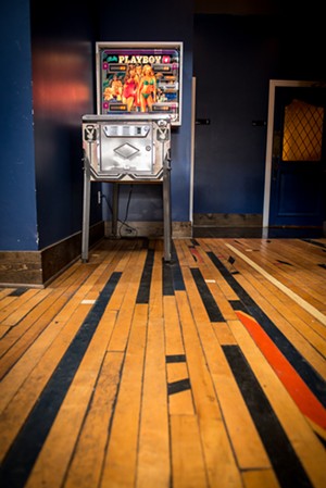 The floors are made from old gymnasium flooring, and the pinball machine is of the vintage Playboy variety. - ALISON MCLEAN