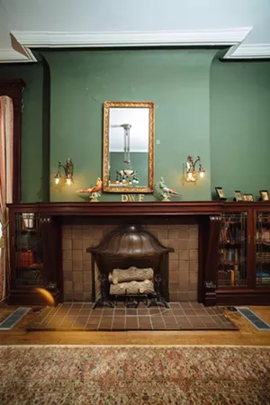The mansion contains seven fireplaces, but this one is unusual. Lore claims that the Alexanders were traveling in Europe, they saw a large bell that they fancied. They purchased it, cut it in two and made the hood of the fireplace from half the bell. - KATHY TRAN
