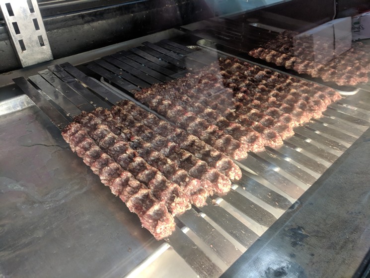 Iraqi kebabs skewered and ready to order in the case at World Food Warehouse. - BRIAN REINHART