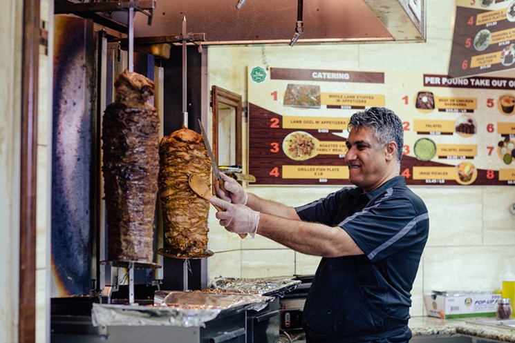 A shawarma plate is prepared at Bilad Bakery and Restaurant. - KATHY TRAN