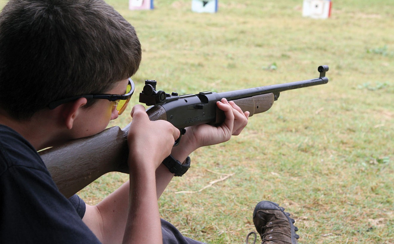A Boy Scout learns safe marksmanship.