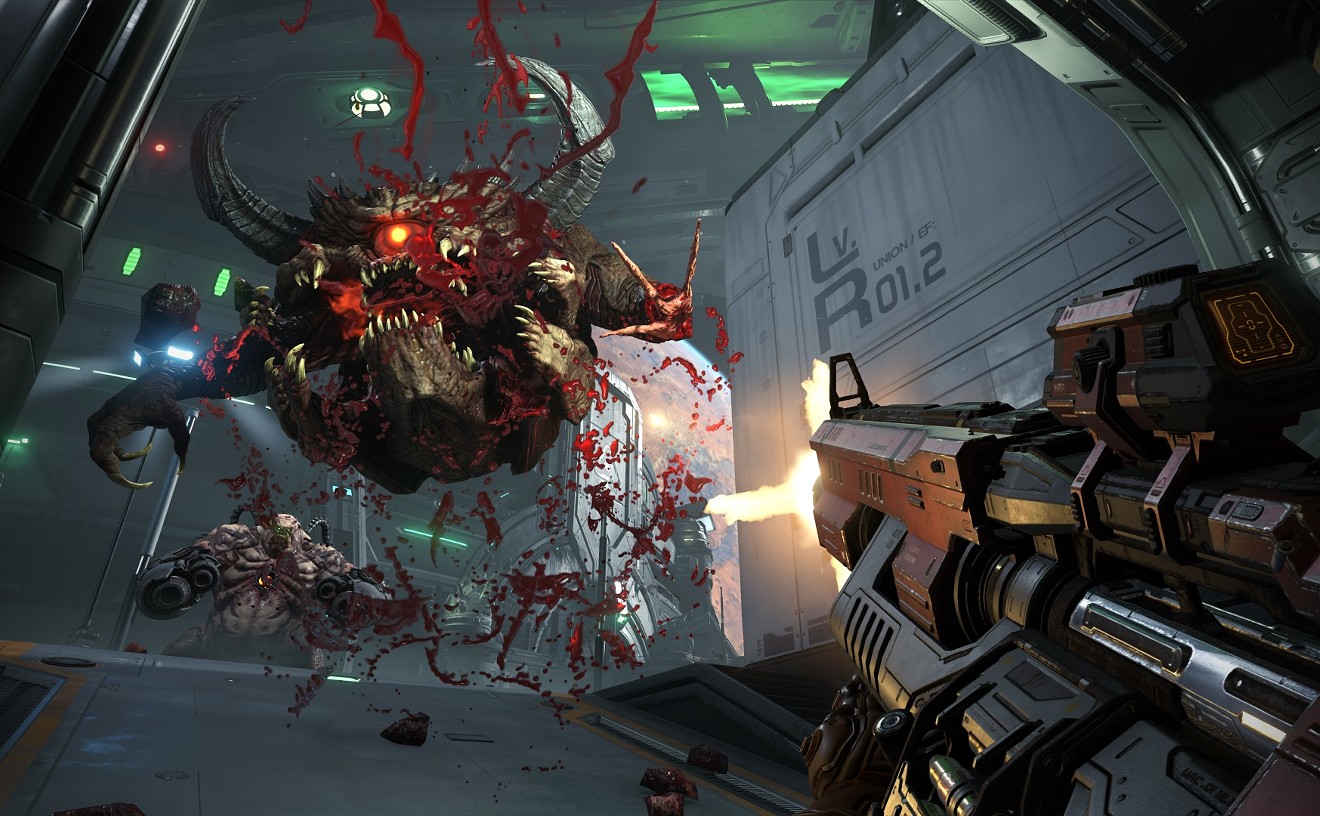 The Doom Slayer blows some very large holes in a Pain Elemental with his high-caliber sniper rifle in DOOM Eternal, one of the many games fans got a glimpse of last weekend at the annual video game convention QuakeCon.