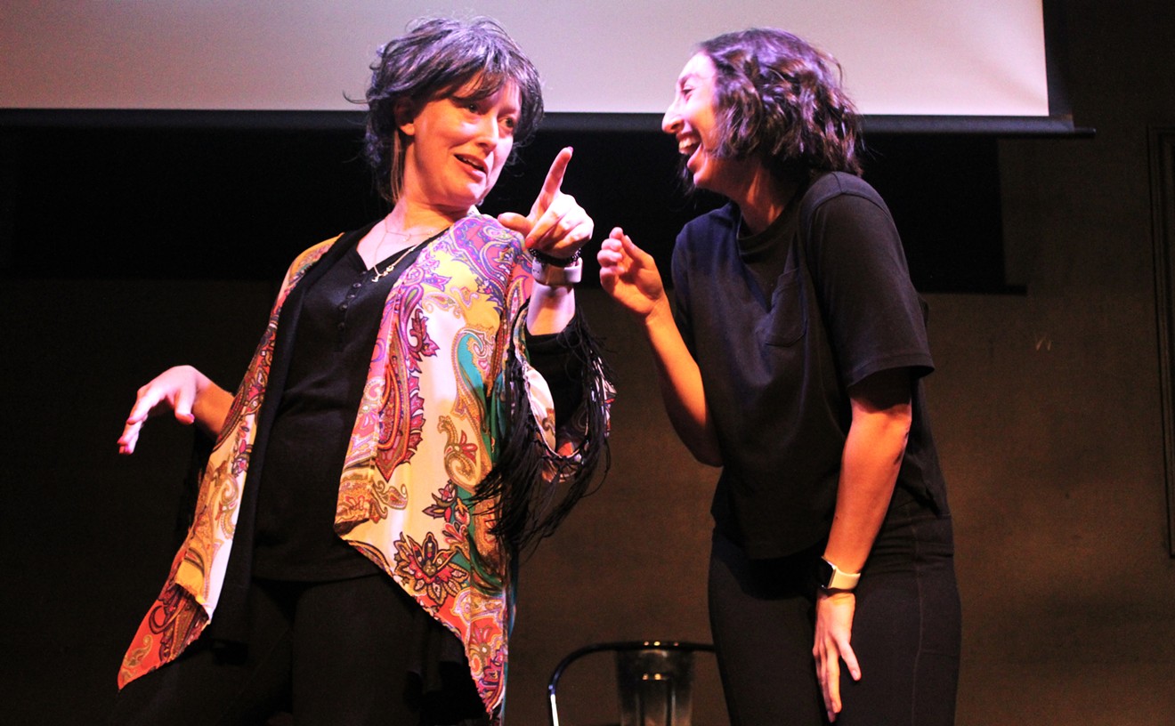 Danielle Pickard, left, and Emily Ruth Davenport perform a scene in the new sketch comedy revue Anything But Men: A Sketch Comedy Revue About the Bechdel Test opening on Friday at Stomping Ground Comedy Theater.