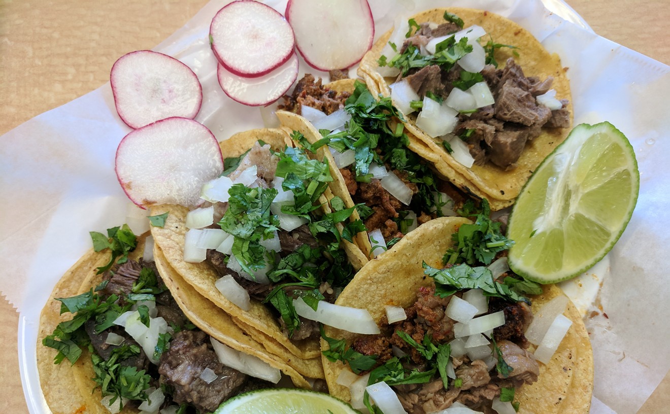 Tacos from Los Tres Mas Taqueros, including carnitas, campechano and three types of cabeza meat.