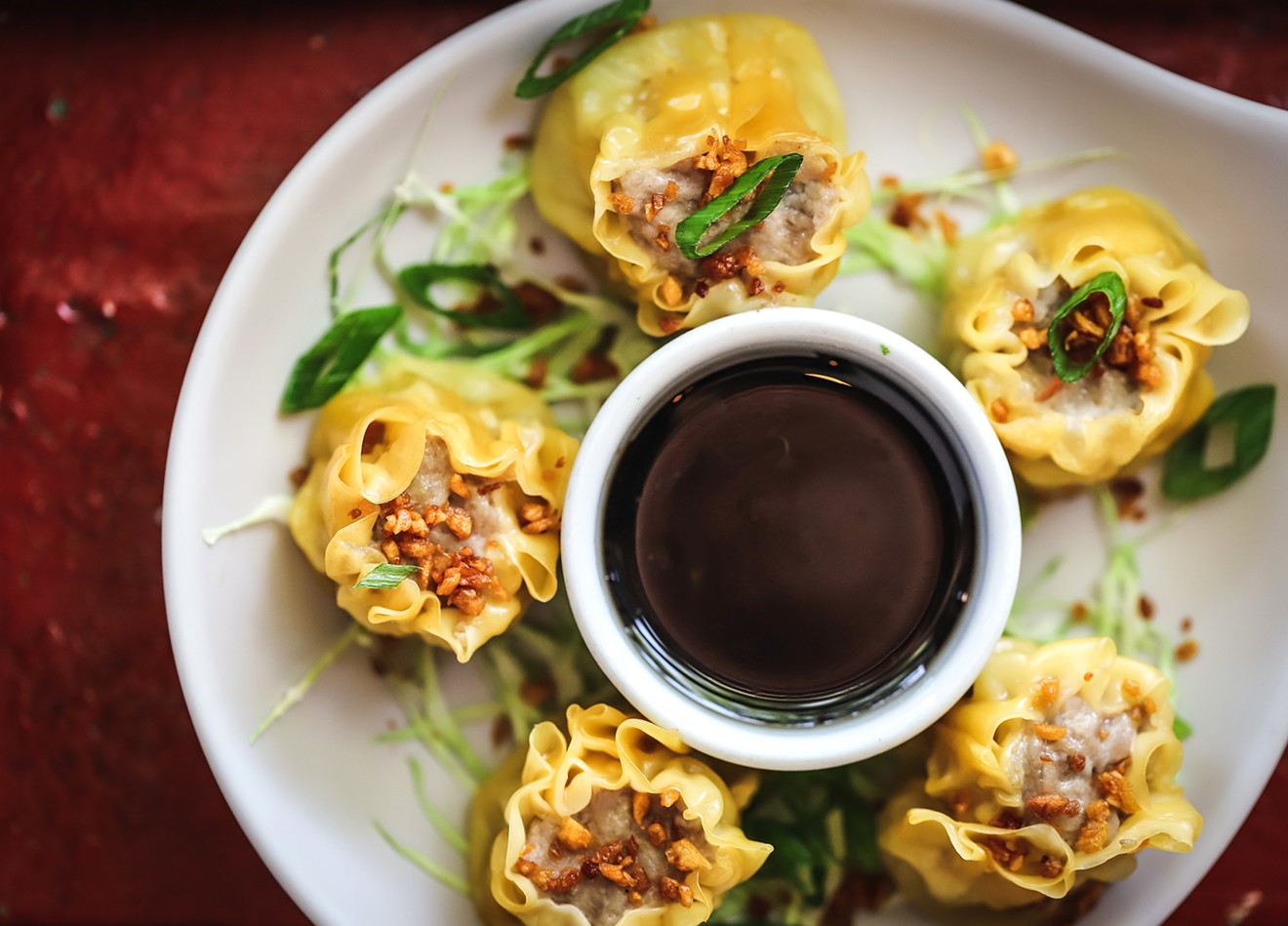 The dumplings at Family Ties ($8.50) are steamed in wonton sheets and served with soy-vinegar sauce.