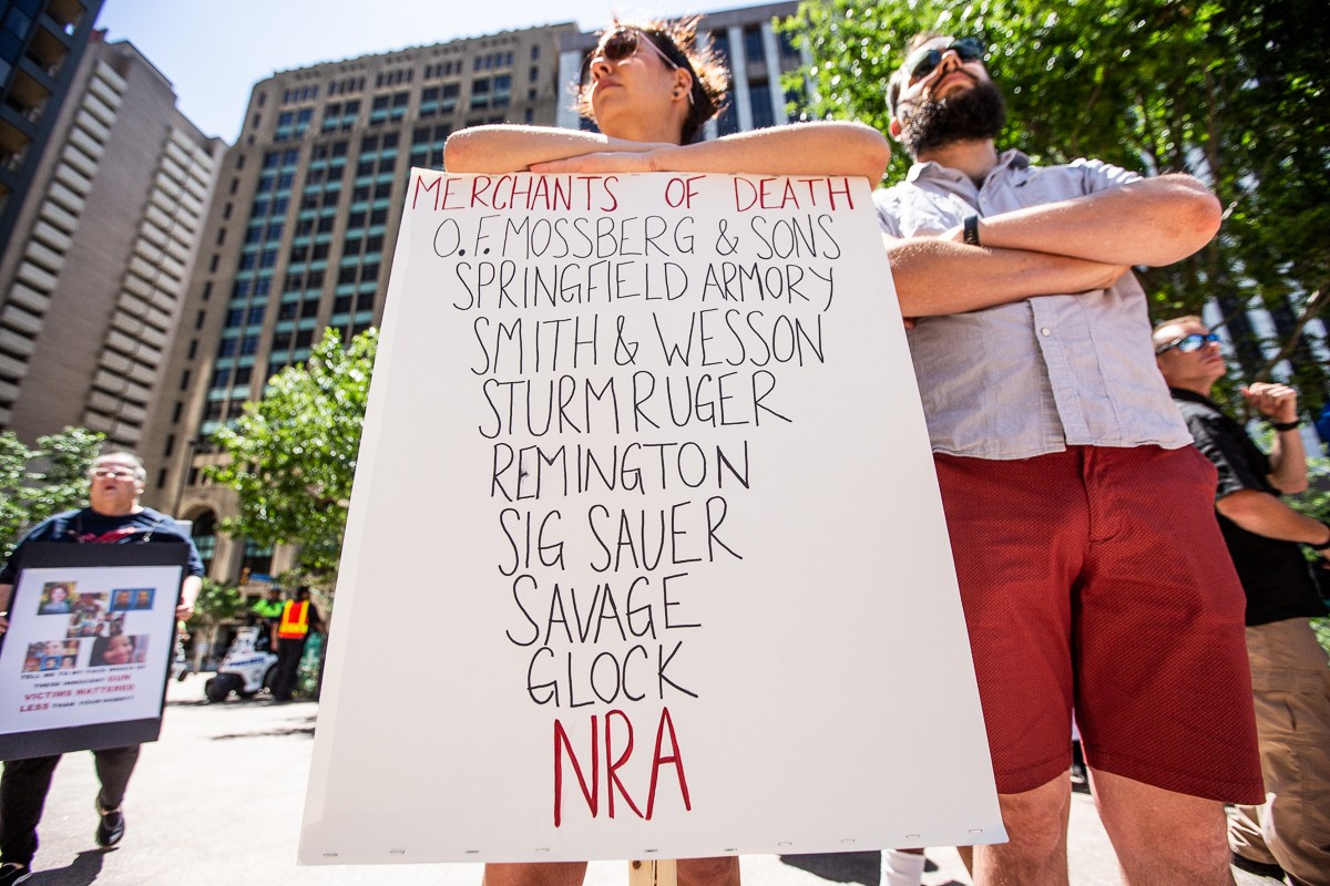 Gun control activists in downtown Dallas gather blocks from the NRA's 2018 Annual Meetings.