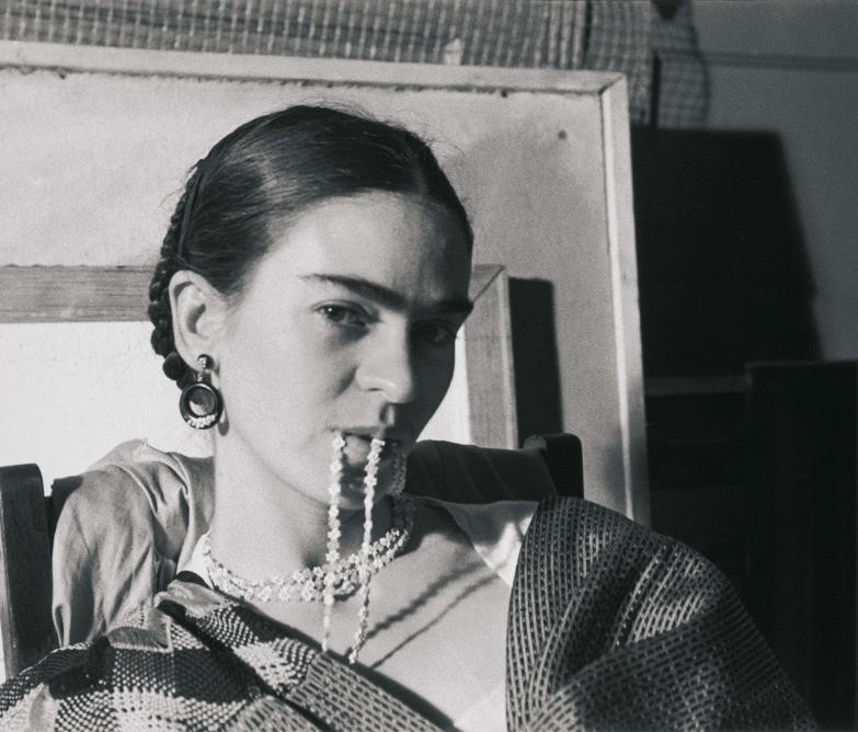 frida_biting_her_necklace_courtesy_pdnb_gallery.jpg