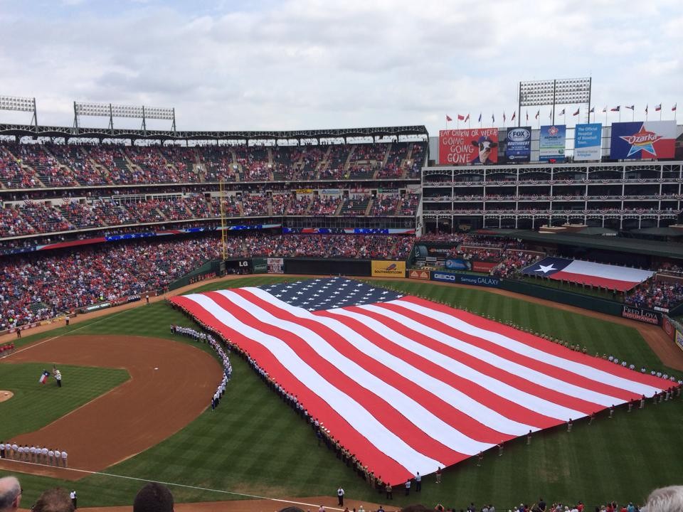 A giant American flag is spread out in the outfield every opening day.
