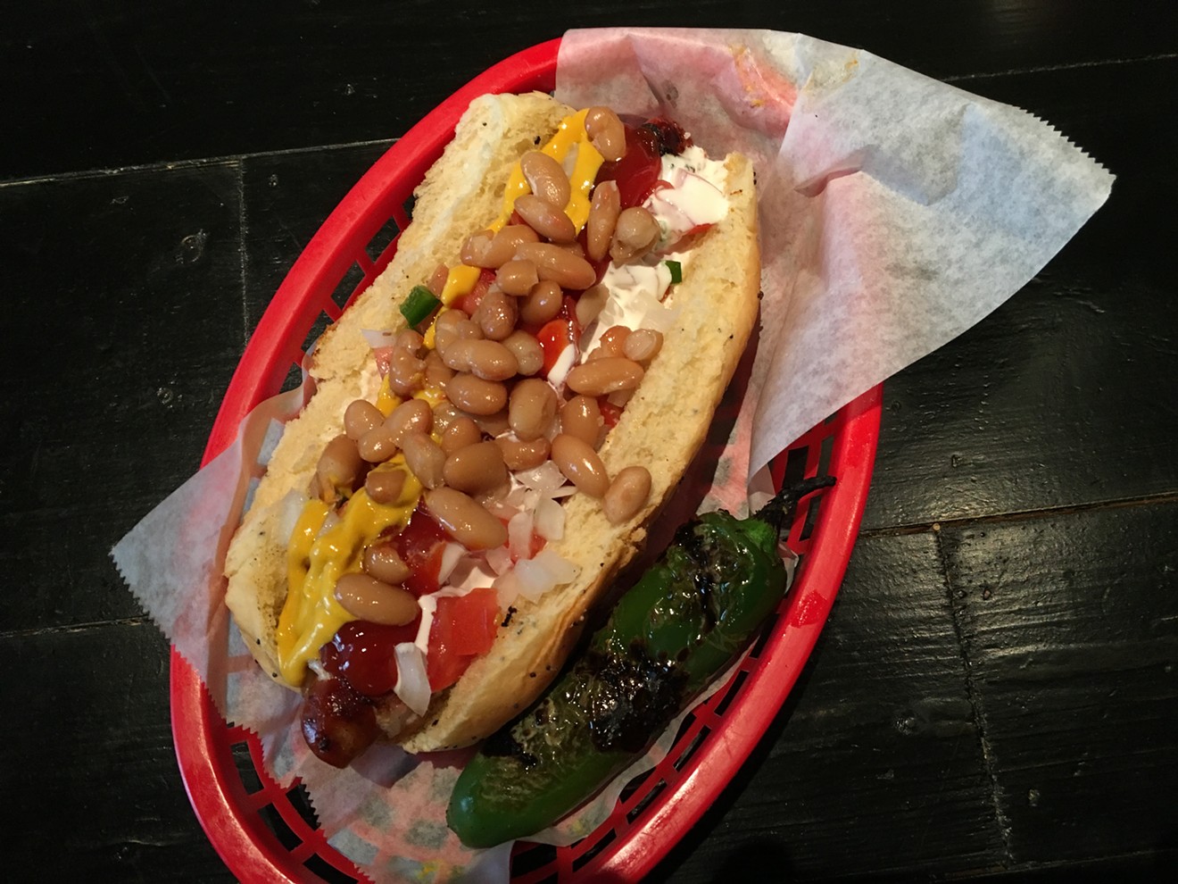 The Mexican Hot Dog at Revolver Taco Lounge ($9) uses a bacon-wrapped Luscher's Red Hot and a bun from Fort Worth's Swiss Pastry Shop.