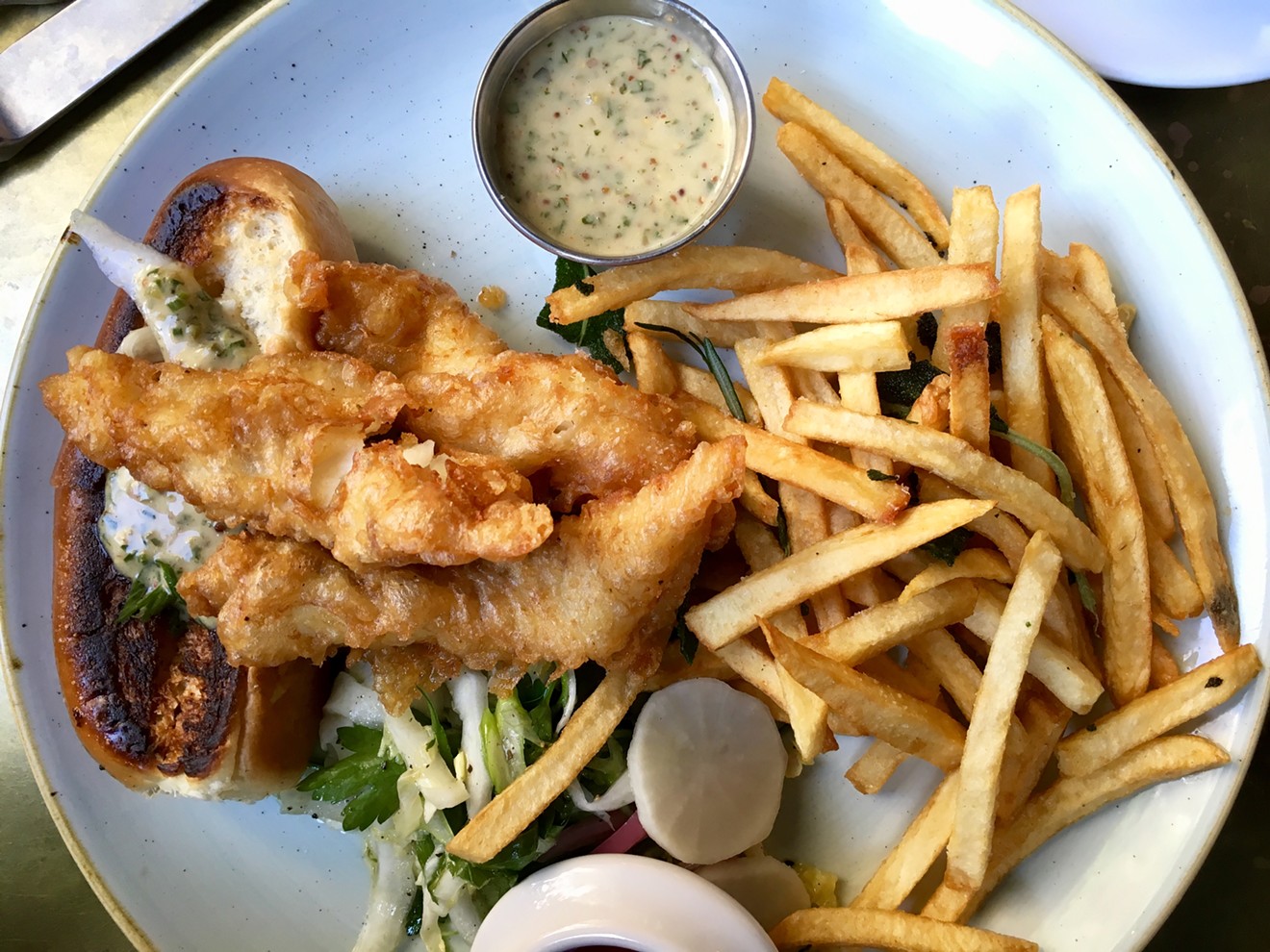 The lunch fried haddock dish is a sort of deconstructed po-boy with remoulade sauce and fries for $15.