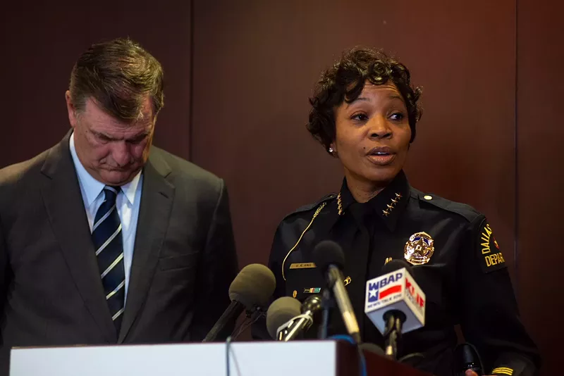 Image: Mayor Mike Rawlings and Dallas police Chief U. Renee Hall talk to reporters Tuesday night about the shooting of two police officers and a Home Depot employee.