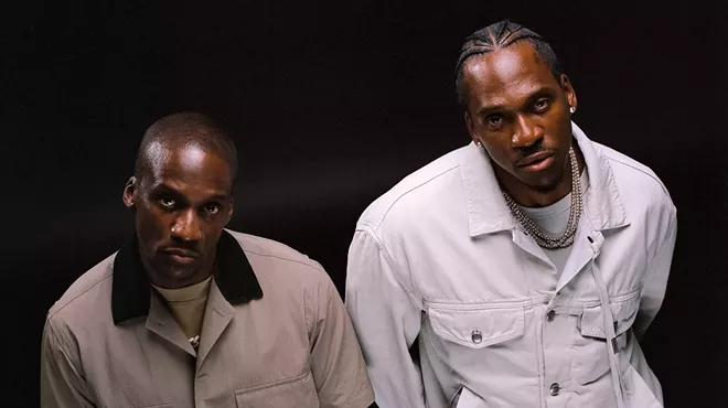 Two men standing posing for a photo