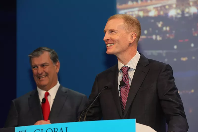 Image: Former VisitDallas CEO Phillip Jones in 2016, right, with Mayor Mike Rawlings