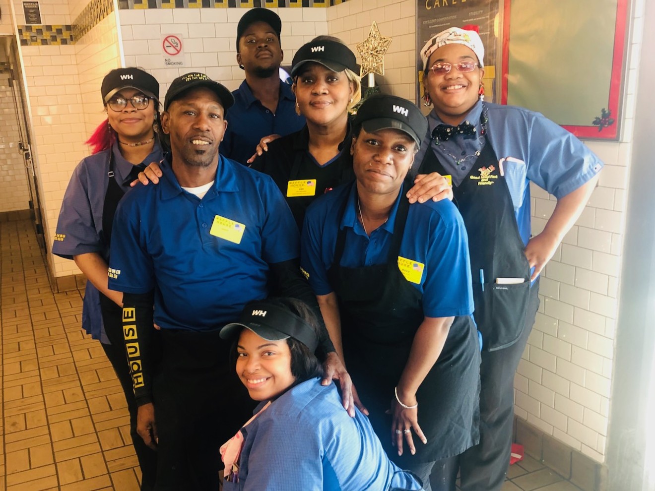 The crew at Waffle House 206 on South Cooper in Arlington. You'll see most of these smiling faces there on Christmas Day.