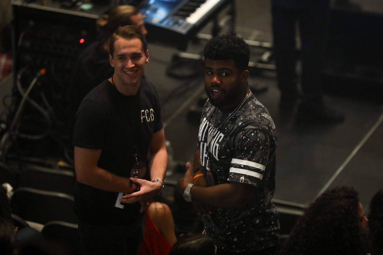 Dallas Cowboys rookie running back Ezekiel Elliott (right) attends a Kanye West concert in Dallas last year.