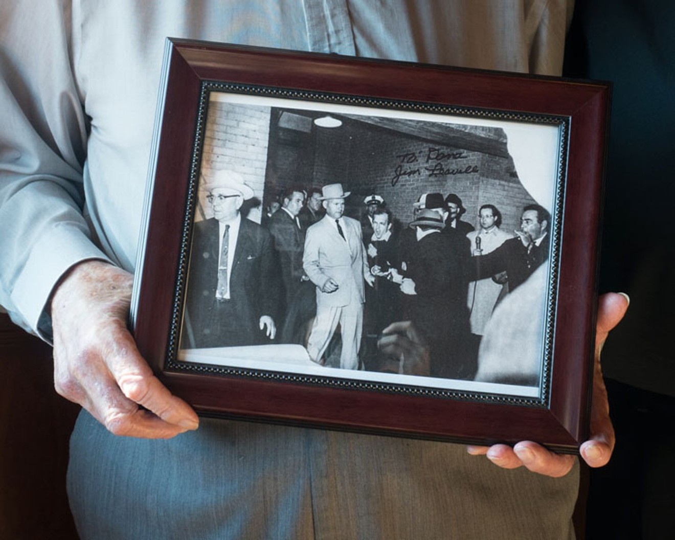 Former homicide detective Jim Leavelle was handcuffed to Lee Harvey Oswald the day Jack Ruby shot Oswald. He's holding Bob Jackson's famous photograph immortalizing the moment.