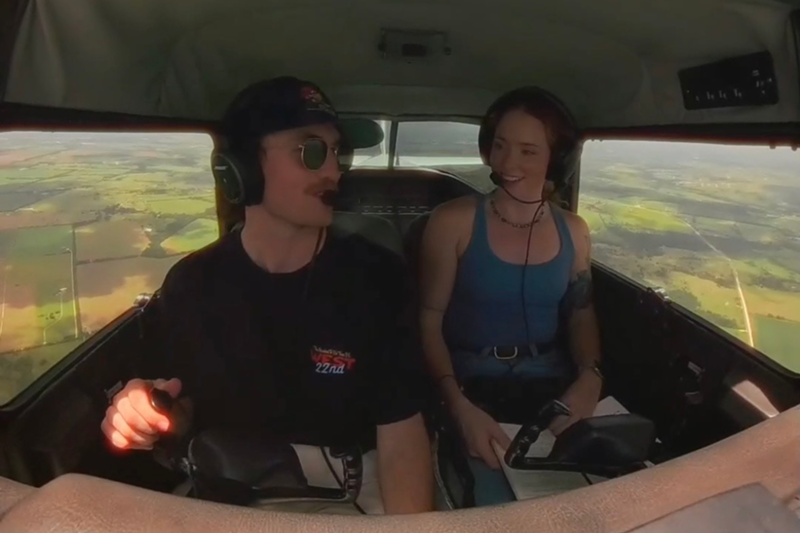 Image: Two people in a plane talking