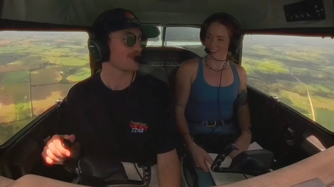Two people in a plane talking