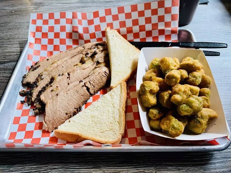 Image: Sliced brisket and fried okra.