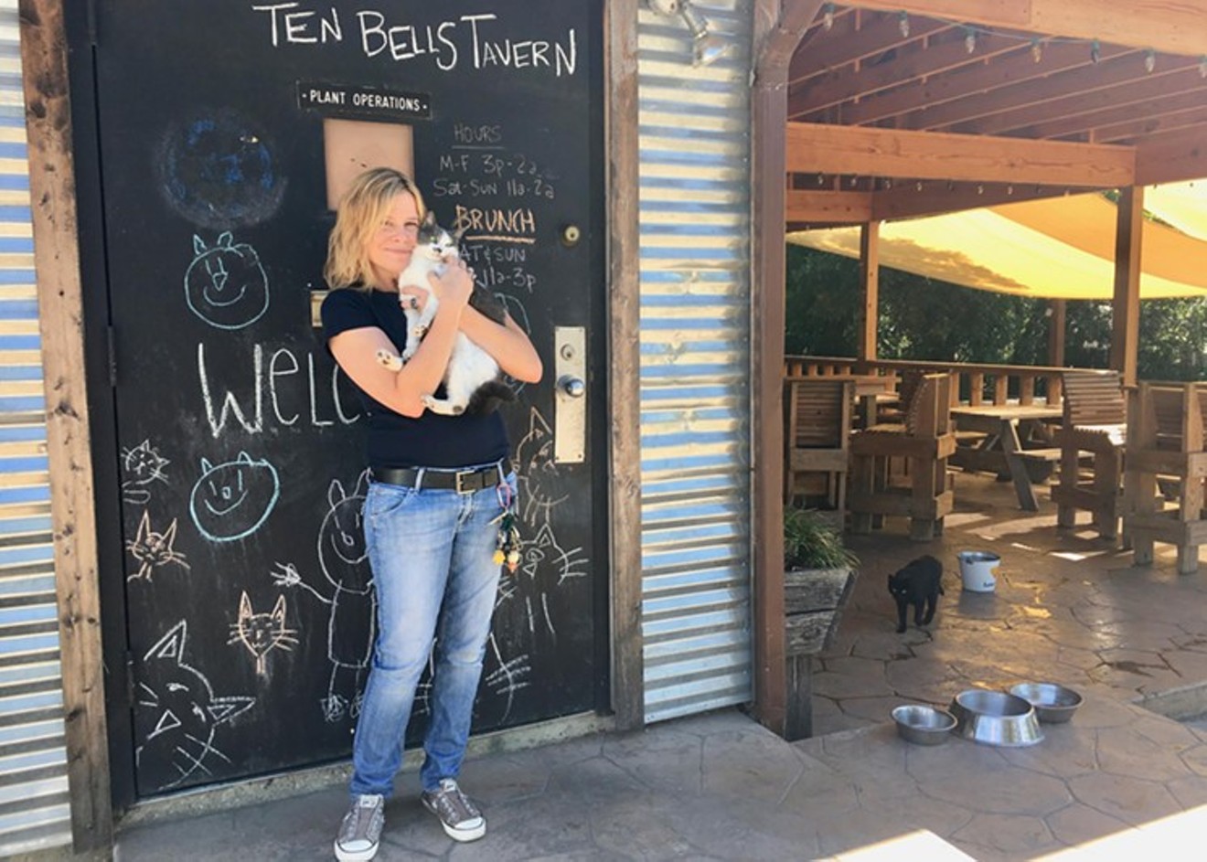 Ten Bells Tavern owner Meri Dahlke cuddled up with Lucy in October 2016.