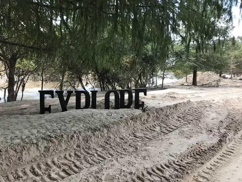 Image: The thick material that the rains of Hurricane Harvey left piled on the ground in Buffalo Bayou Park in Houston is not beach sand. Your nose would tell you that much.