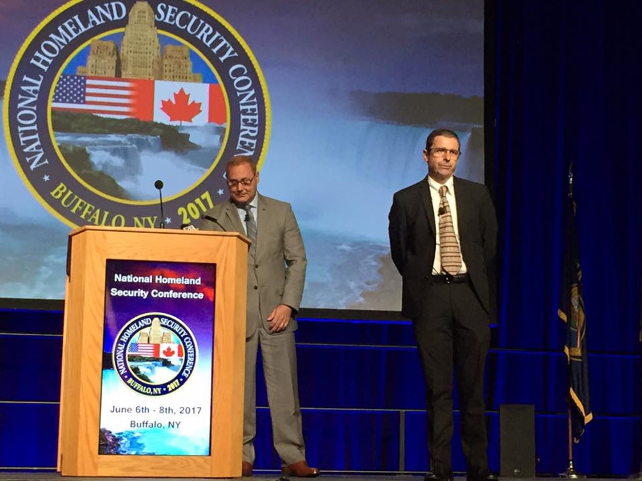 Dallas Fire and Rescue Chief David Coatney (left) and interim Dallas Police Chief David Pughes address the National Homeland Security Conference in Buffalo, New York.