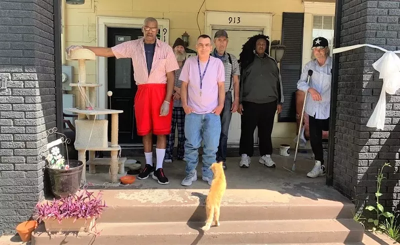 Image: Jacob's House is a boarding house in Oak Cliff operated by the Well Community. The cat, named Skins, is a favorite boarder.