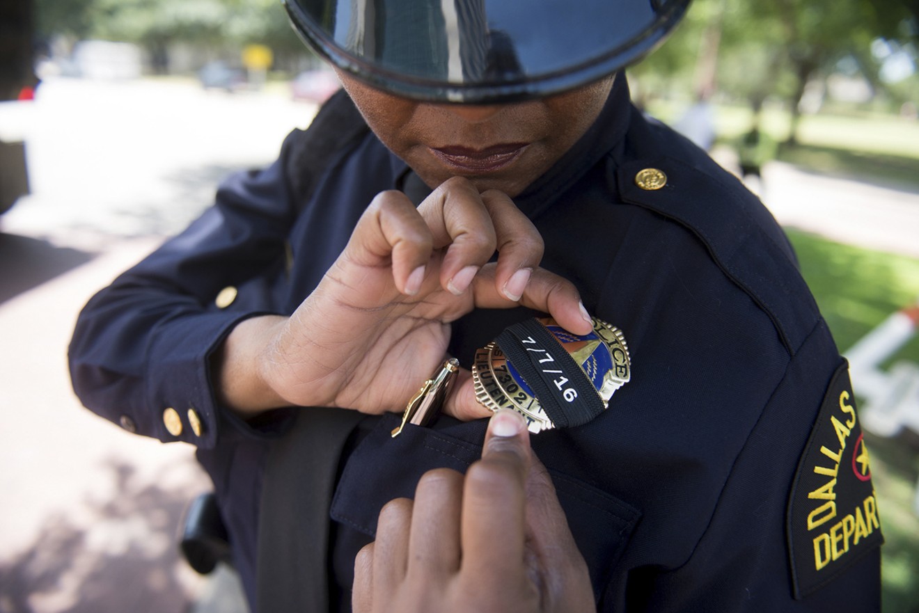 A Dallas officer marked her badge in remembrance of July 7, 2016, at the May 17, 2017, memorial service.