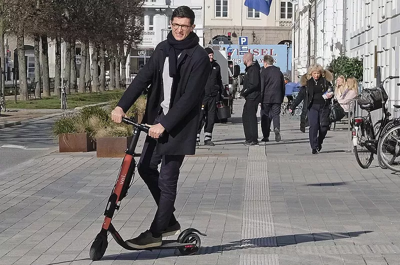Image: A scooter rider in Copenhagen shows off his moves.