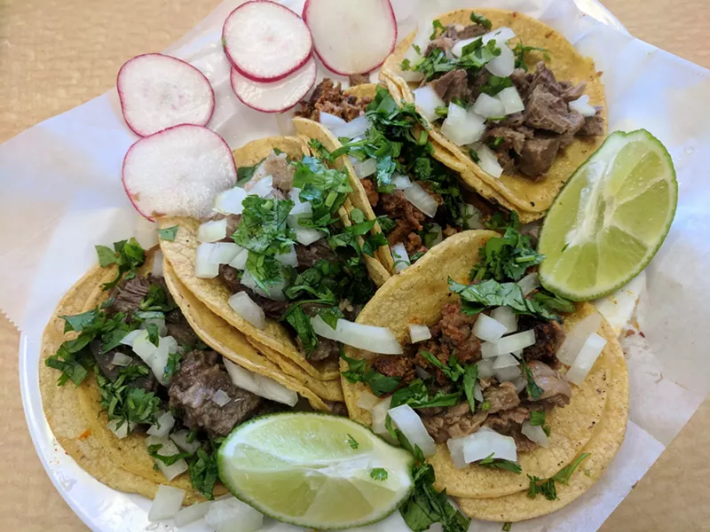 Image: Tacos from Los Tres Mas Taqueros, including carnitas, campechano and three types of cabeza meat.