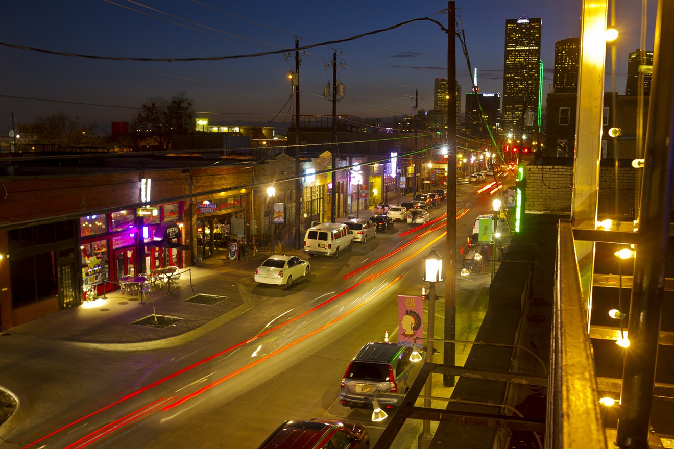 Overlooking Elm Street at dusk from the roof deck at the Green Room in Deep Ellum