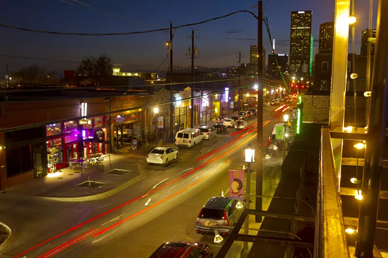 Image: Overlooking Elm Street at dusk from the roof deck at the Green Room in Deep Ellum