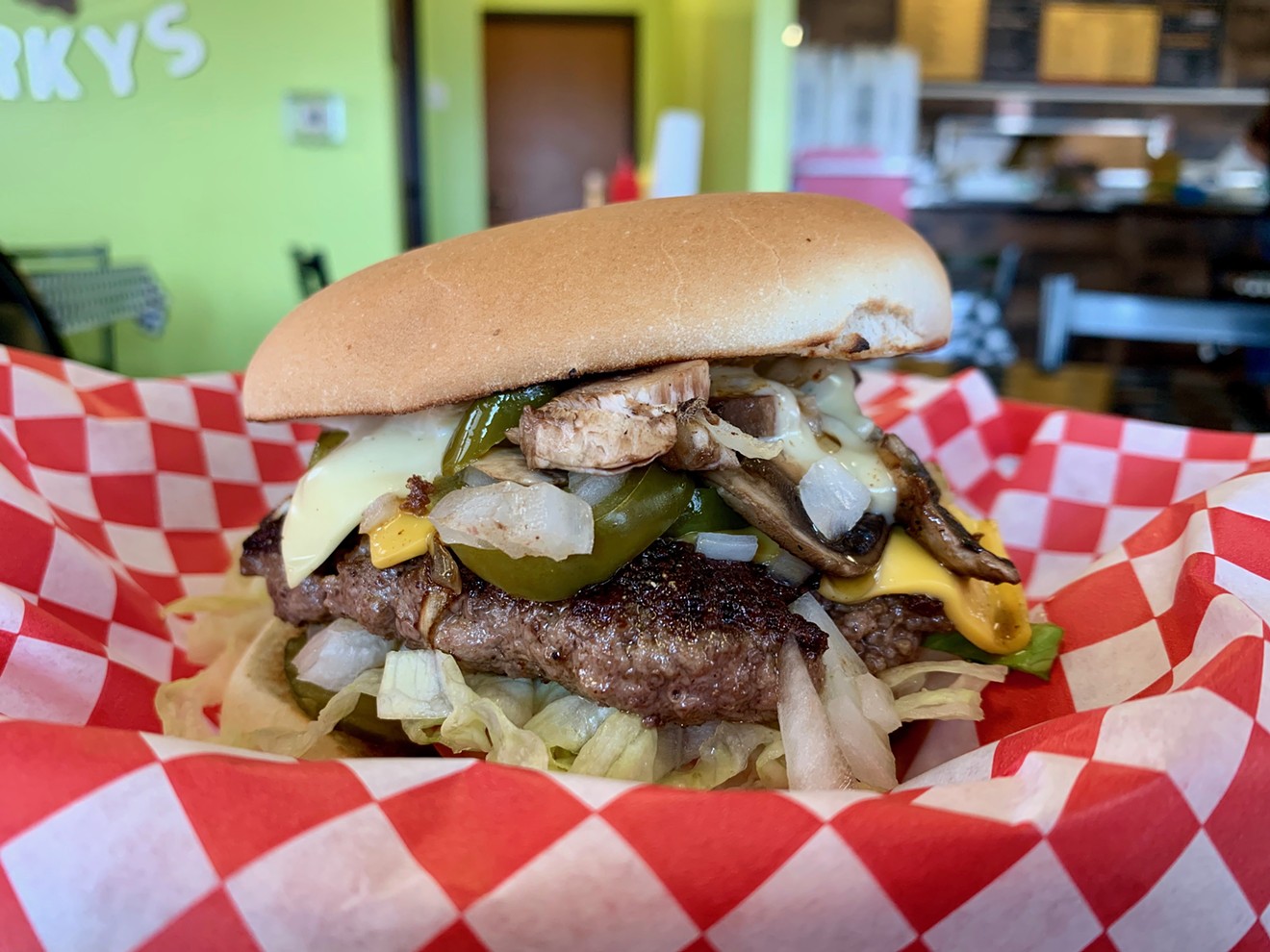 The Full Moon burger at Porky's with pickles, onions, mushrooms, jalapeños and a generous amount of American cheese.