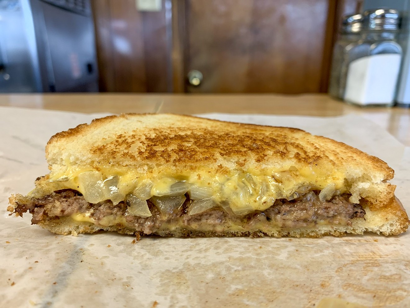 American cheese, griddled onions, seared beef on the patty melt at Dairy-Ette in Far East Dallas.