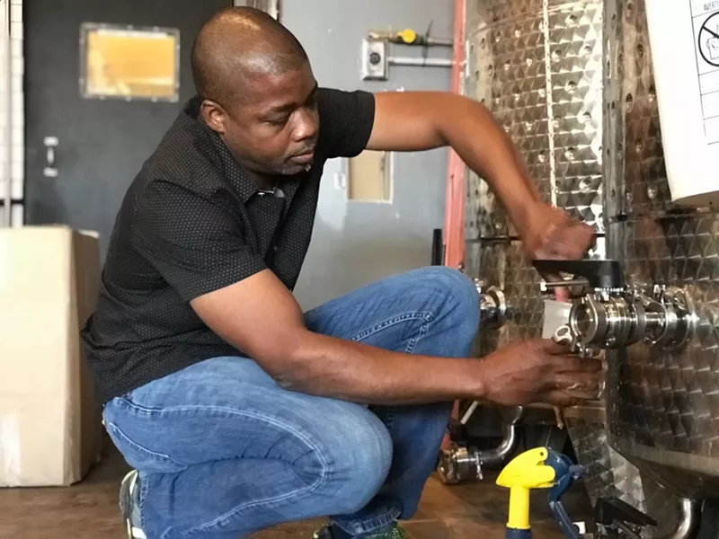 Image: Barrett Tillman checks on a saison called Gypsy Forest — made with hickory bark, cinnamon bark and geisha leaves — that he's brewing at Small Brewpub as part of a new subscription beer program he's launching there this summer.