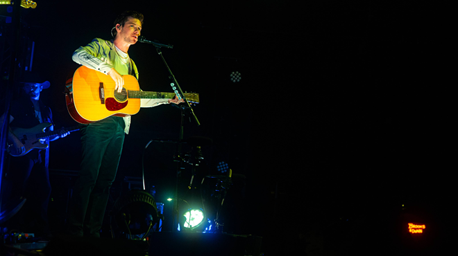 Man performing with guitar