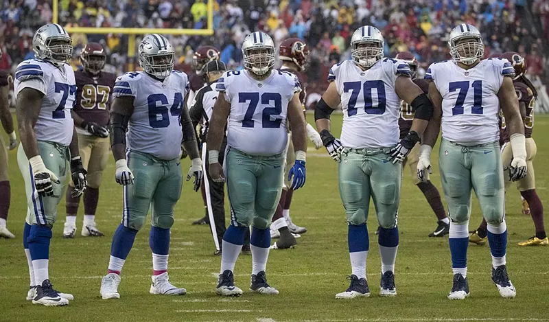 Image: Zack Martin (No. 70) was a leader on one of the most dominant offensive lines the NFL has ever seen.