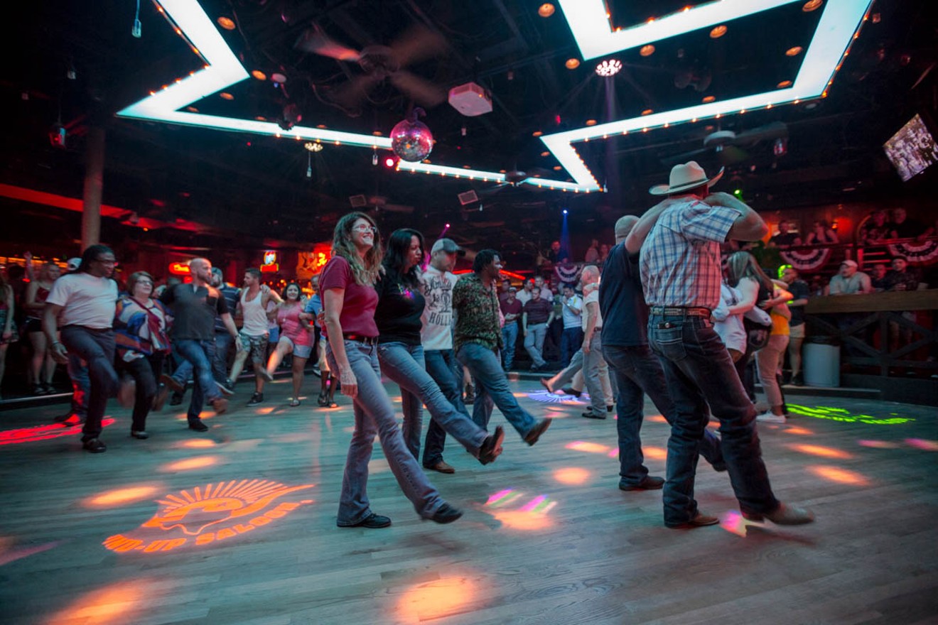 A group line dancing at The Round-Up Saloon and Dance Hall