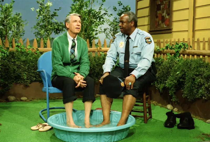 Image: Won’t You Be My Neighbor? is a documentary that paints a flattering portrait of Fred Rogers (left), who doesn't mind getting his feet wet with Officer Clemmons (Francois Clemmons) in a 1969 episode of Mr. Rogers’ Neighborhood.