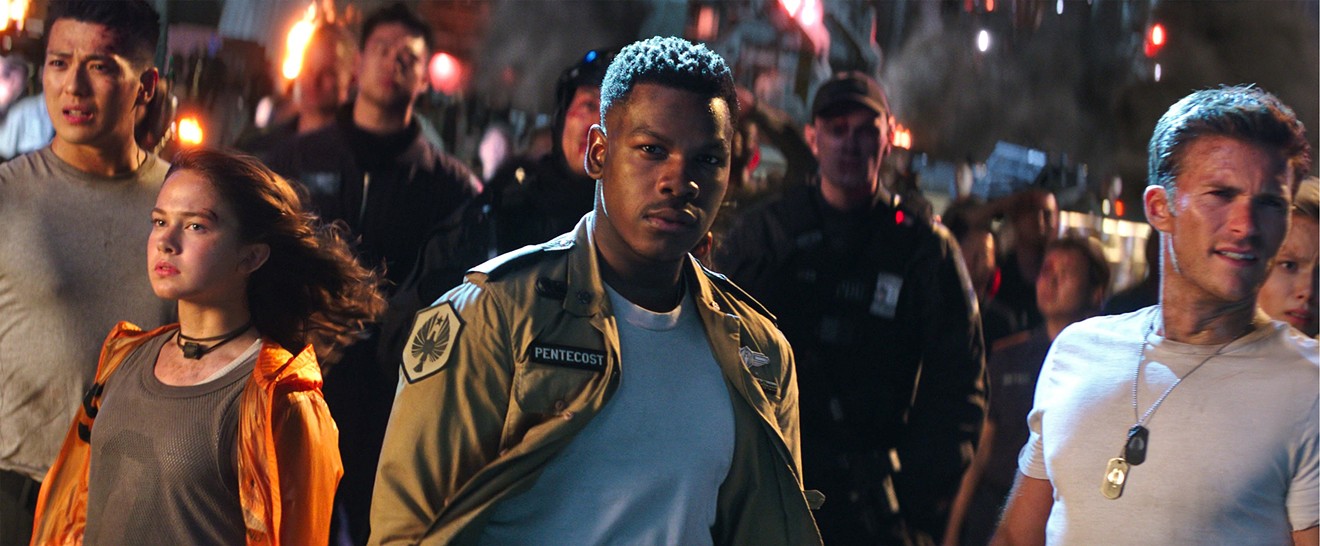The cast of Pacific Rim Uprising includes (from left): Cailee Spaeny as Amara, John Boyega as Jake and Scott Eastwood as Nate.